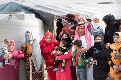 Residents at a Syrian refugee camp in the Beqaa Valley of eastern Lebanon prepare to greet Secretary-General Ban Ki-moon during his visit on 25 March 2016.