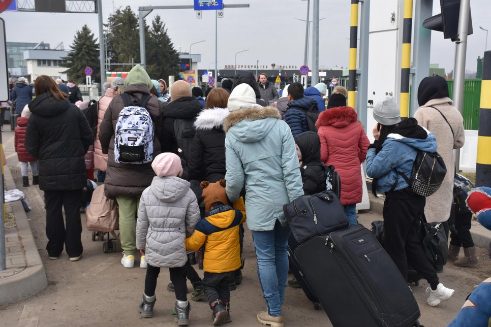 Refugees entering Poland at border crossing point Medyka